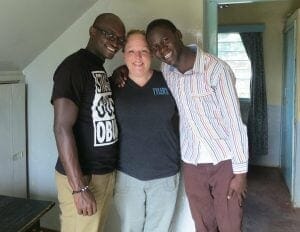 Geoffrey with staff members Moses and Ashley.